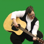 Participant playing acoustic guitar