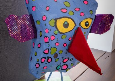 Paper maché sculpture of polka dot bird