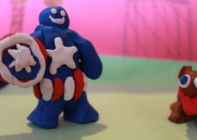Superhero and dog made out of clay